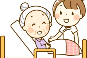 患者のベッドサイドに立つ看護師