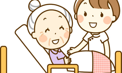 患者のベッドサイドに立つ看護師
